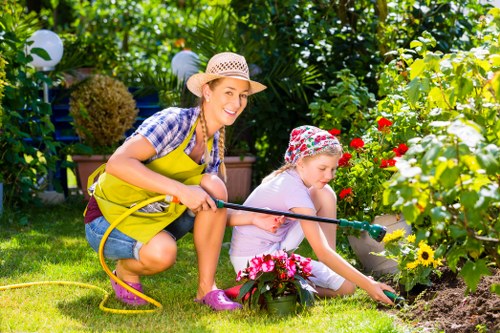 Professional lawn mowing service maintaining a garden in Plumstead